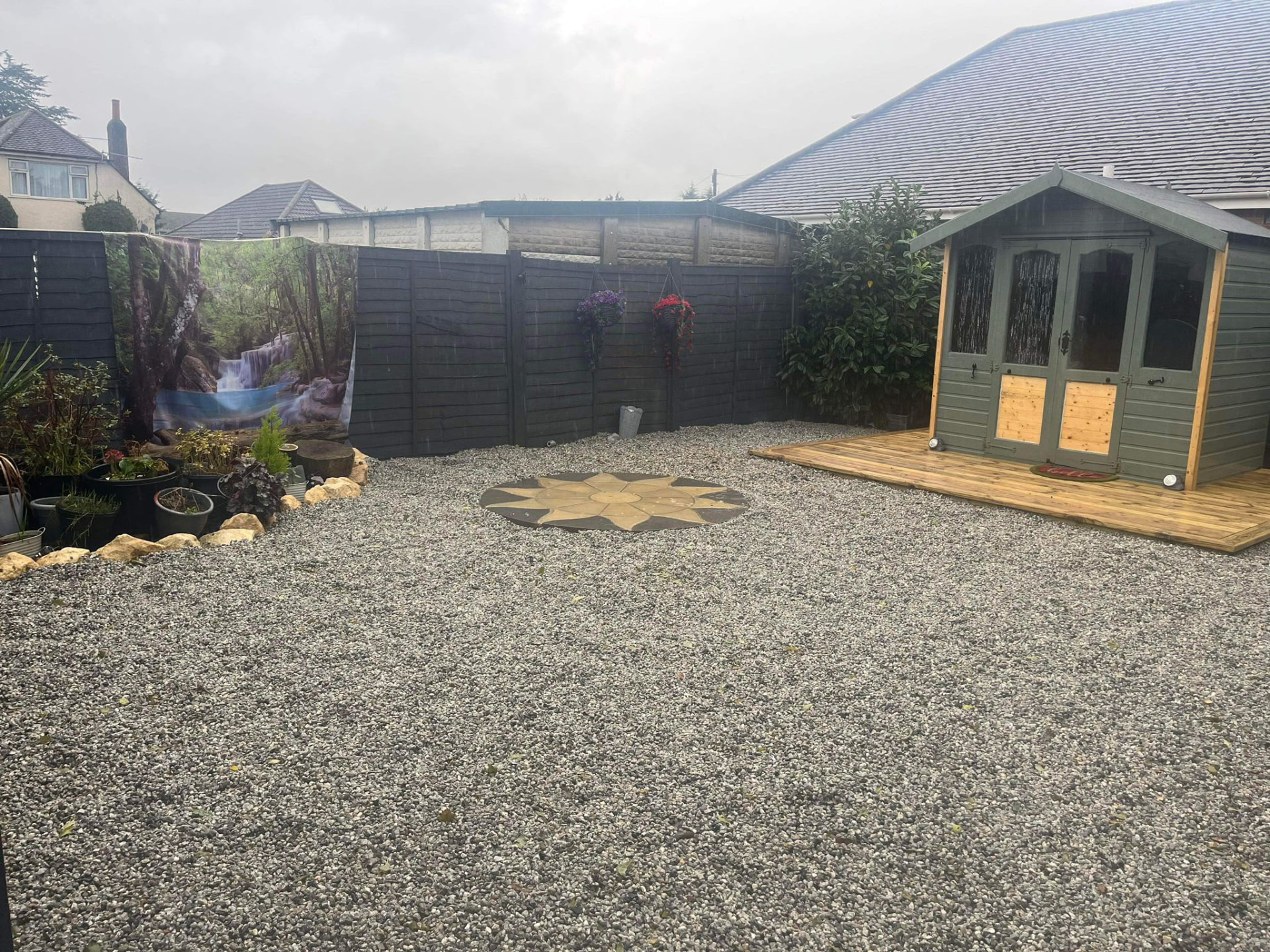 Complete garden redesign with fresh lawn, patio and planted borders