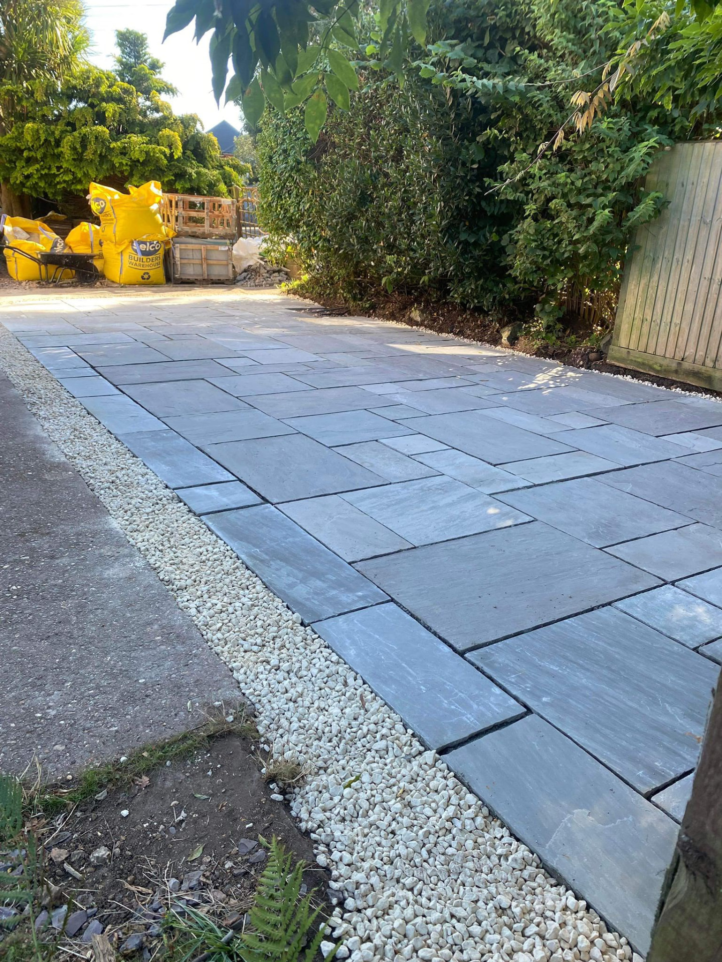 Newly completed stone patio with border detail in Chandlers Ford